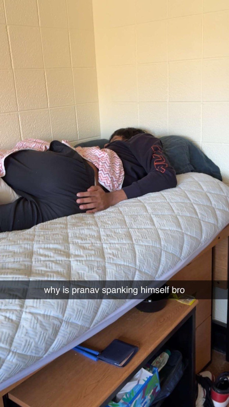 Pranav fast asleep on his lofted dorm bed, hand resting on his own backside